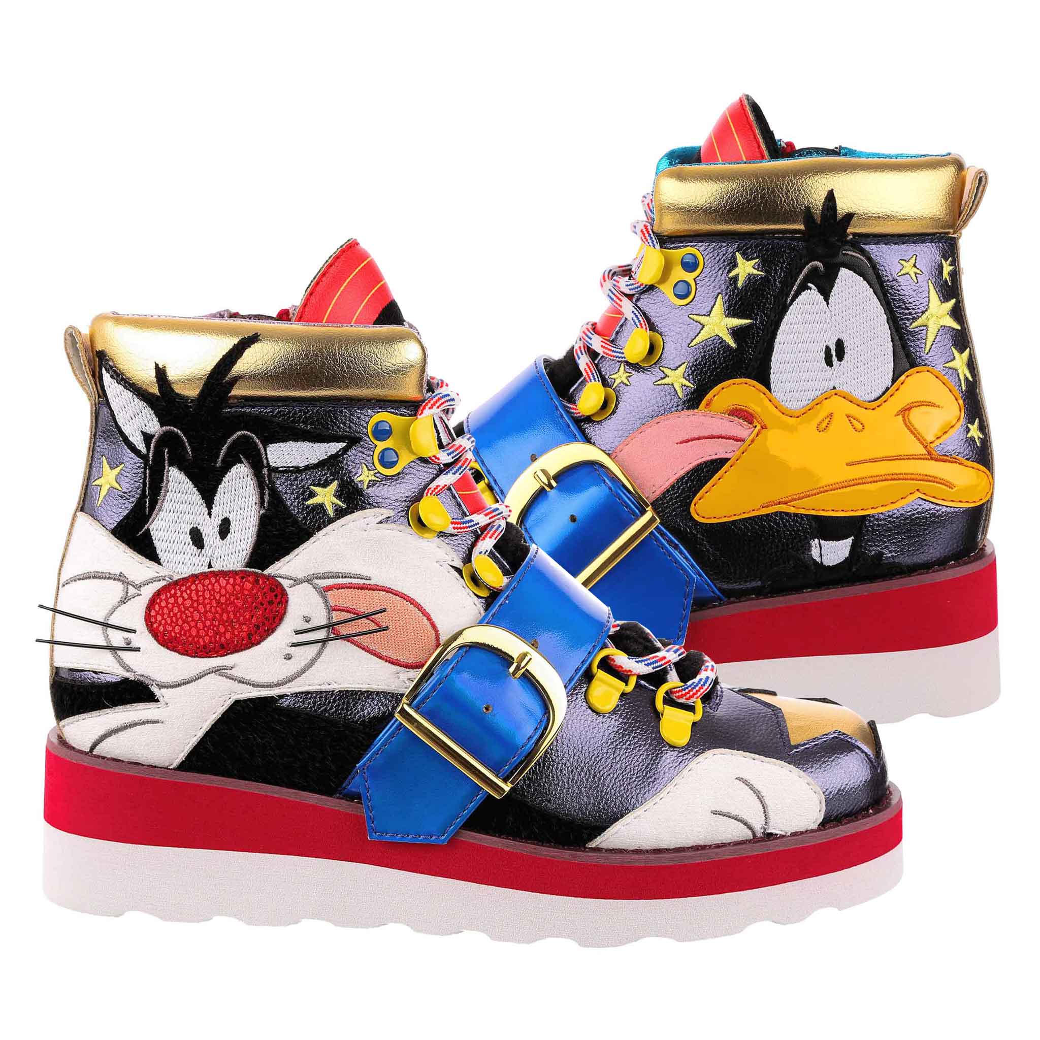 High top unisex trainers with metallic navy fabric, on the left foot is Daffy Duck, and the right foot is Sylvester the Cat, who are made from a combination of embroidery and applique. Finished with striped laces and a statement bright blue strap across the laces with a gold buckle.